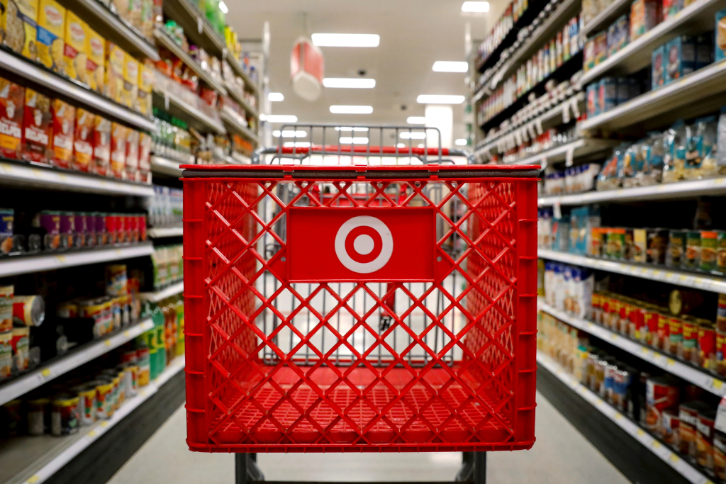 Target shopping cart placed in the grocery aisle.